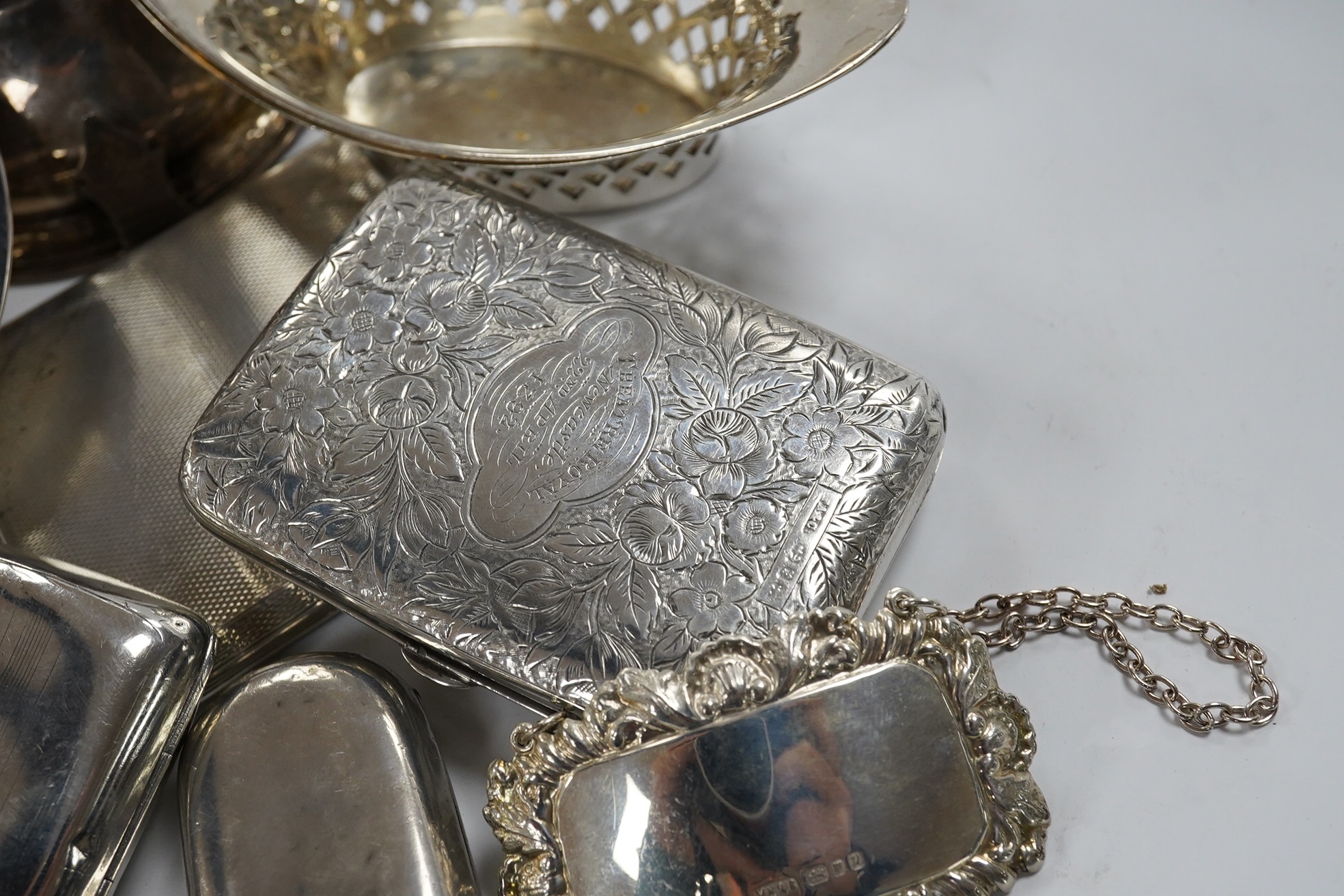 Sundry small silver including a modern wine funnel, silver dishes including cased, cigarette cases, sovereign case, wine label etc. Condition - poor to fair